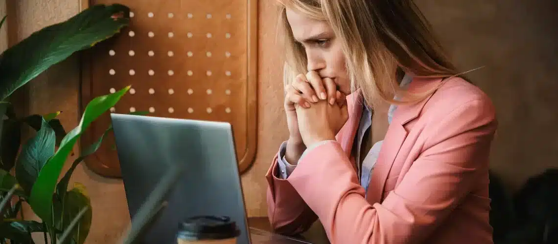 hypnosis, hypnotherapy, health A woman with Generalised Anxiety Disorder is sitting in front of a laptop.