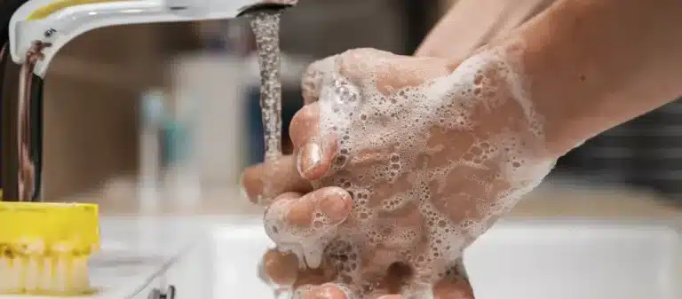 hypnosis, hypnotherapy, health A person washing their hands with soap in a sink.