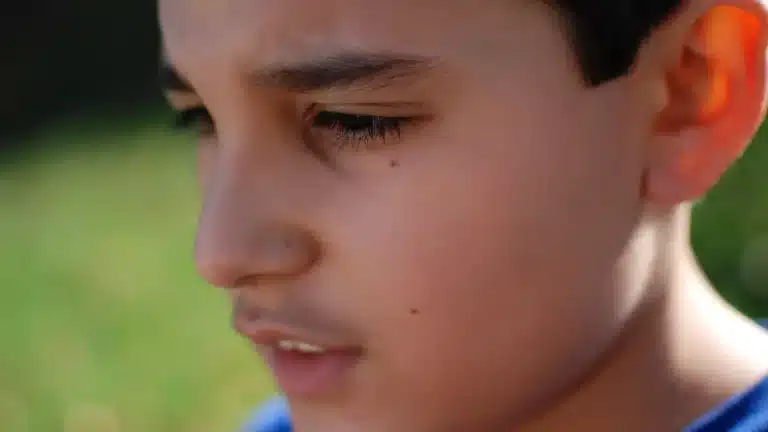 hypnosis, hypnotherapy, health A close up of a boy staring at the camera.