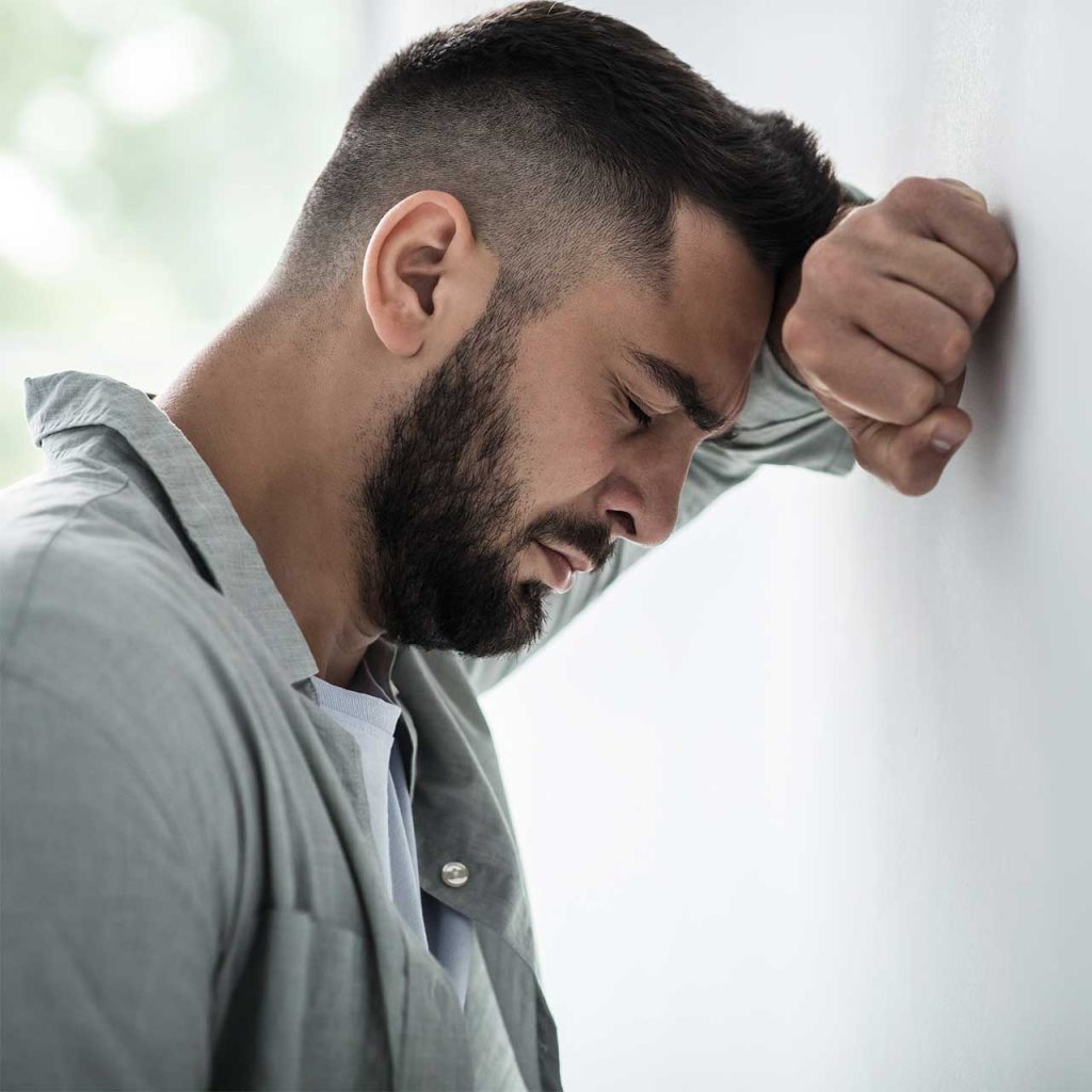 Man participating in a personalised self-hypnosis session for depression.