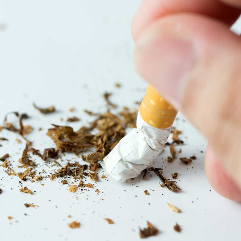 Broken cigarette representing smoking cessation through hypnotherapy techniques