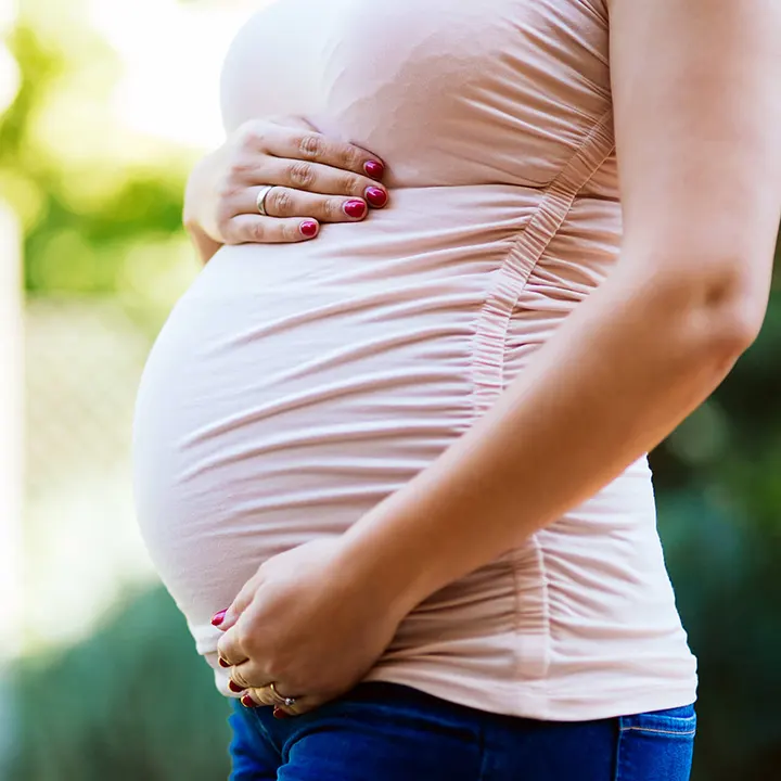 Expectant couple practicing self-hypnosis techniques for a positive pregnancy