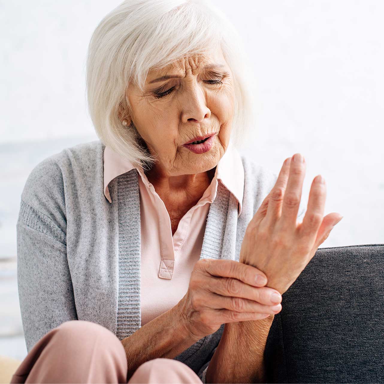 Person practising self-hypnosis techniques for arthritis pain relief at home