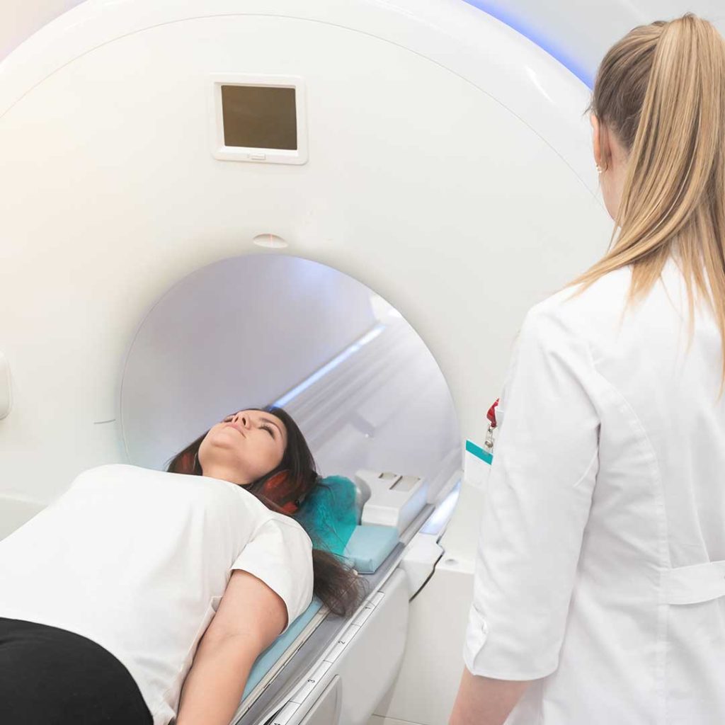 Close-up of MRI machine with patient, highlighting self-hypnosis benefits