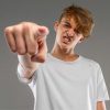 Child with arms crossed, demonstrating anger management challenges