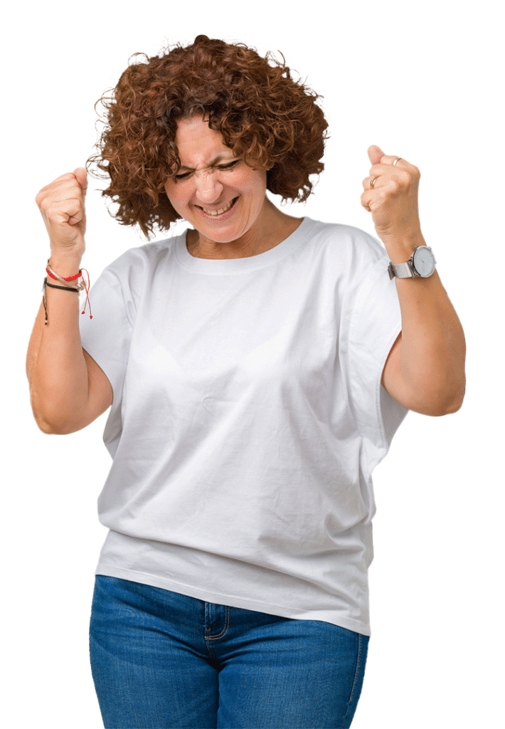 A Person With Curly Hair, Wearing A White Shirt And Jeans, Clenches Their Fists And Closes Their Eyes, Appearing Excited Or Triumphant.